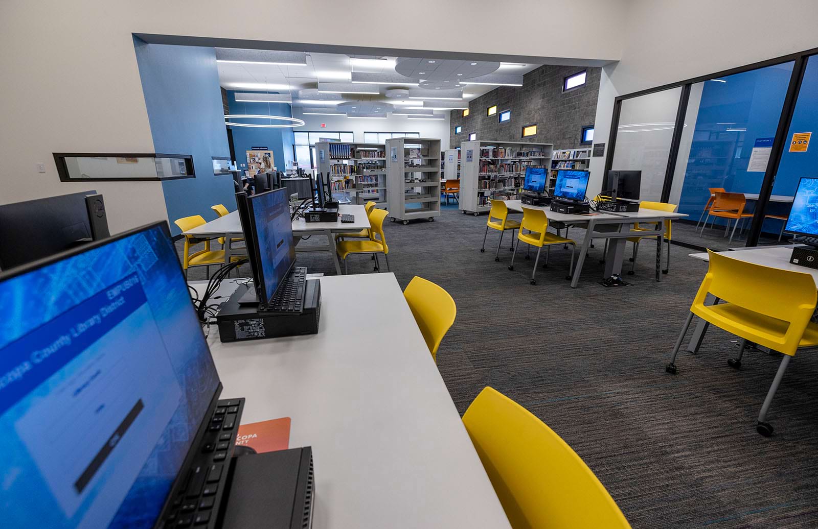 Photo of the computer area with bookshelves in the background